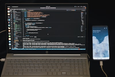 person comparing CRM software features on laptop