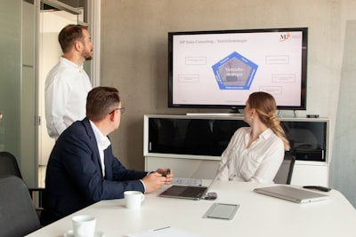 real estate team collaborating with CRM dashboard