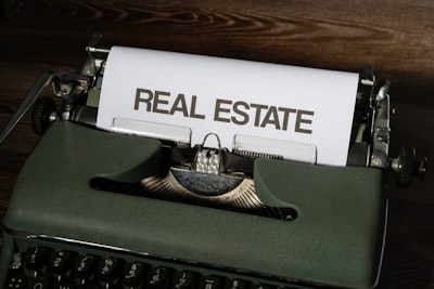 real estate agent hand calculating commission