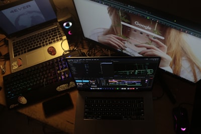 real estate agent editing video on laptop, using trending music and effects