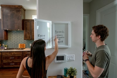 real estate agent showing smart home features to client