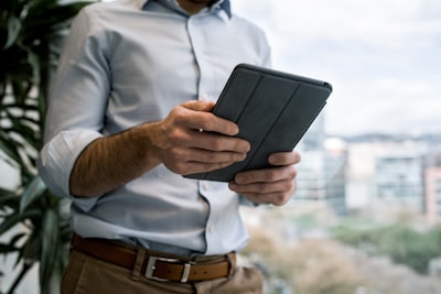 real estate agent using CRM on tablet