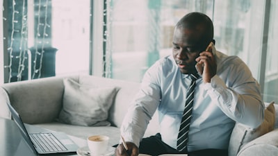 real estate agent on phone in modern office setting
