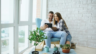 real estate agent showing modern apartment to couple