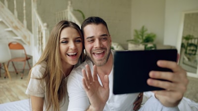 happy couple viewing virtual home tour