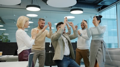 successful real estate sales team celebrating