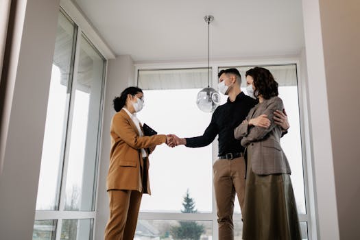 real estate agent shaking hands with client after successful deal, with social media icons in background
