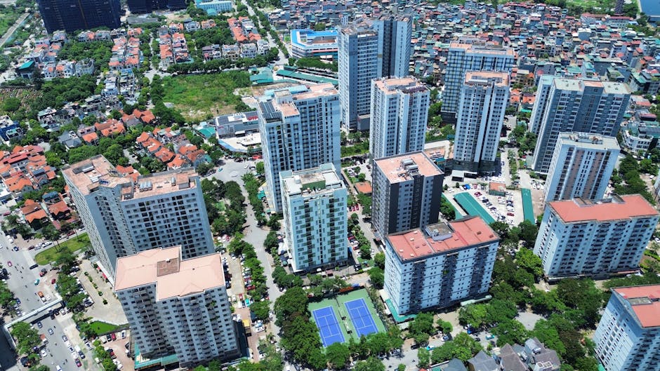 Aerial photography showcasing high-rise buildings in Hanoi, Vietnam, highlighting urban life and architecture.