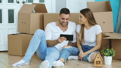 couple looking at real estate on tablet