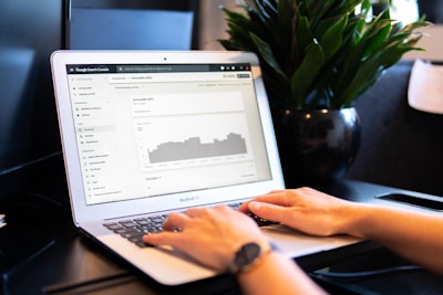 real estate agent using CRM on laptop