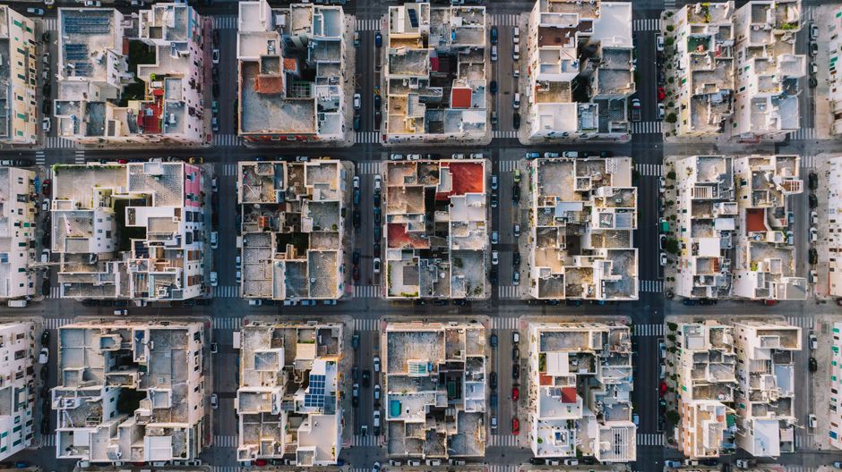 High-altitude aerial photo showing grid layout of Monopoli, Italy's residential district.