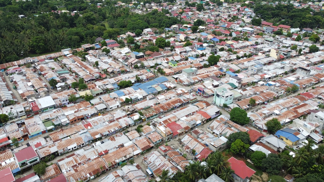 an aerial view of a city with lots of houses
