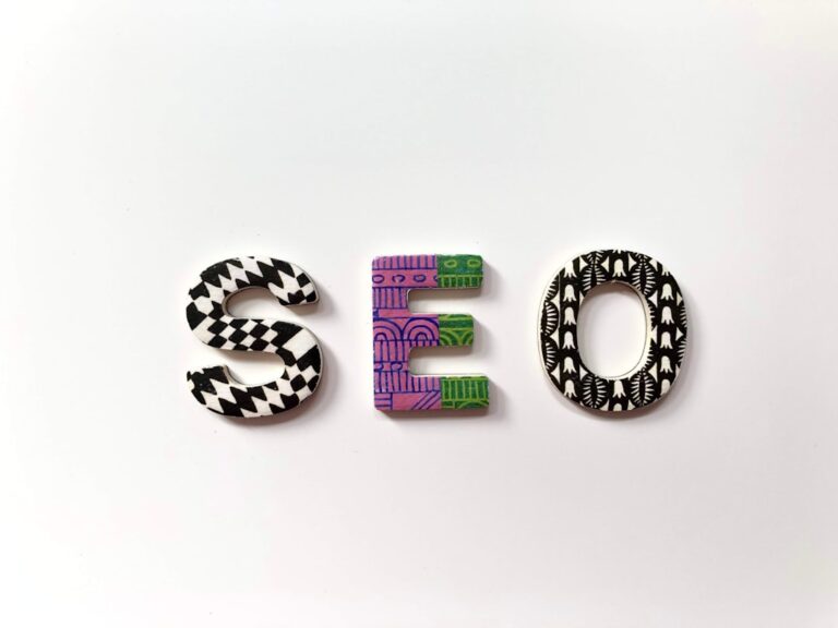 The letters S, E, and O with patterned surfaces on a white background