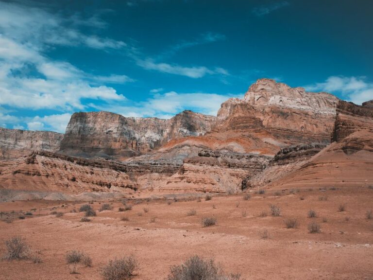 Stunning view of sandstone cliffs under a bright sky in Marble Canyon, Arizona.