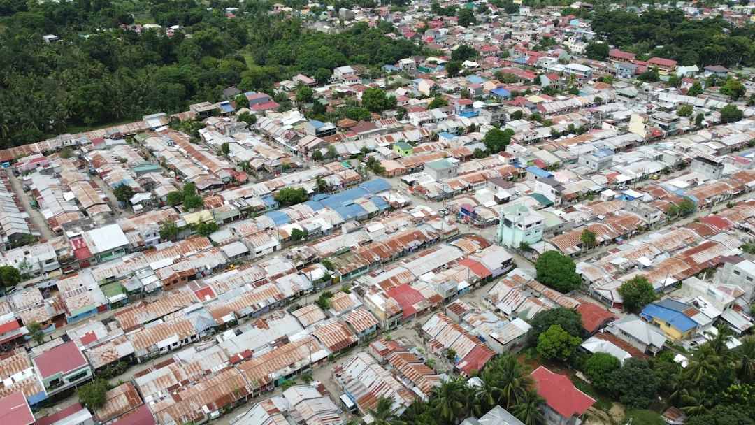 an aerial view of a city with lots of houses