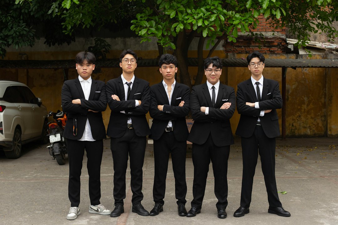 a group of young men standing next to each other