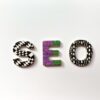The letters S, E, and O with patterned surfaces on a white background