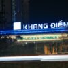 a building with a neon sign that reads kong dien